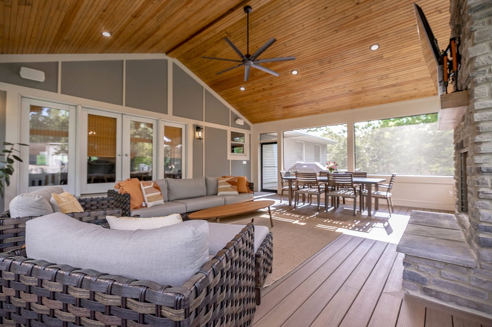 Vaulted screened porch in Greater Cincinnati with wood ceiling, fan, and stylish seating area