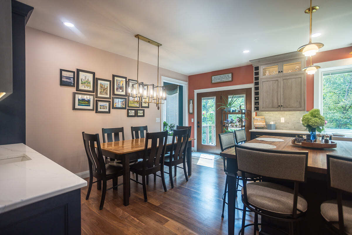 Kitchen and dining remodel with custom Amish-built cabinets, wood floors, and warm gathering spaces.