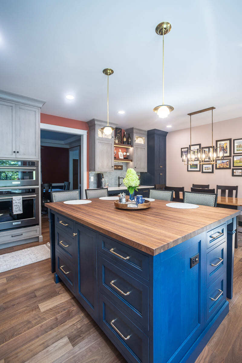 Legacy Builders Group kitchen remodel with blue island, wood countertop, pendant lighting, and Amish-built cabinets.