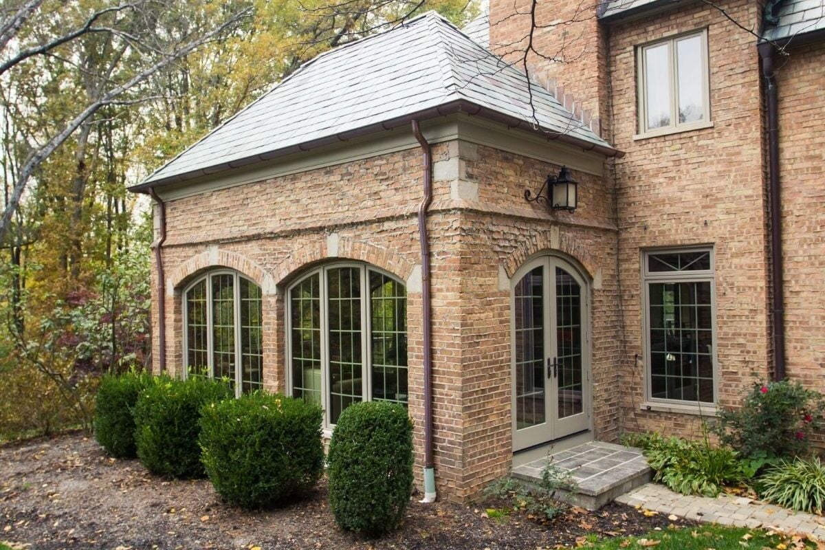 Brick home addition with arched windows and French doors blending with the original architecture located in Cincinnati (1)