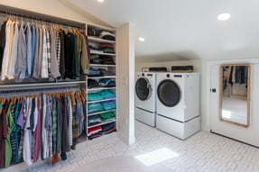 Open closet in master suite with laundry in Cincinnati remodel by Legacy Builders Group