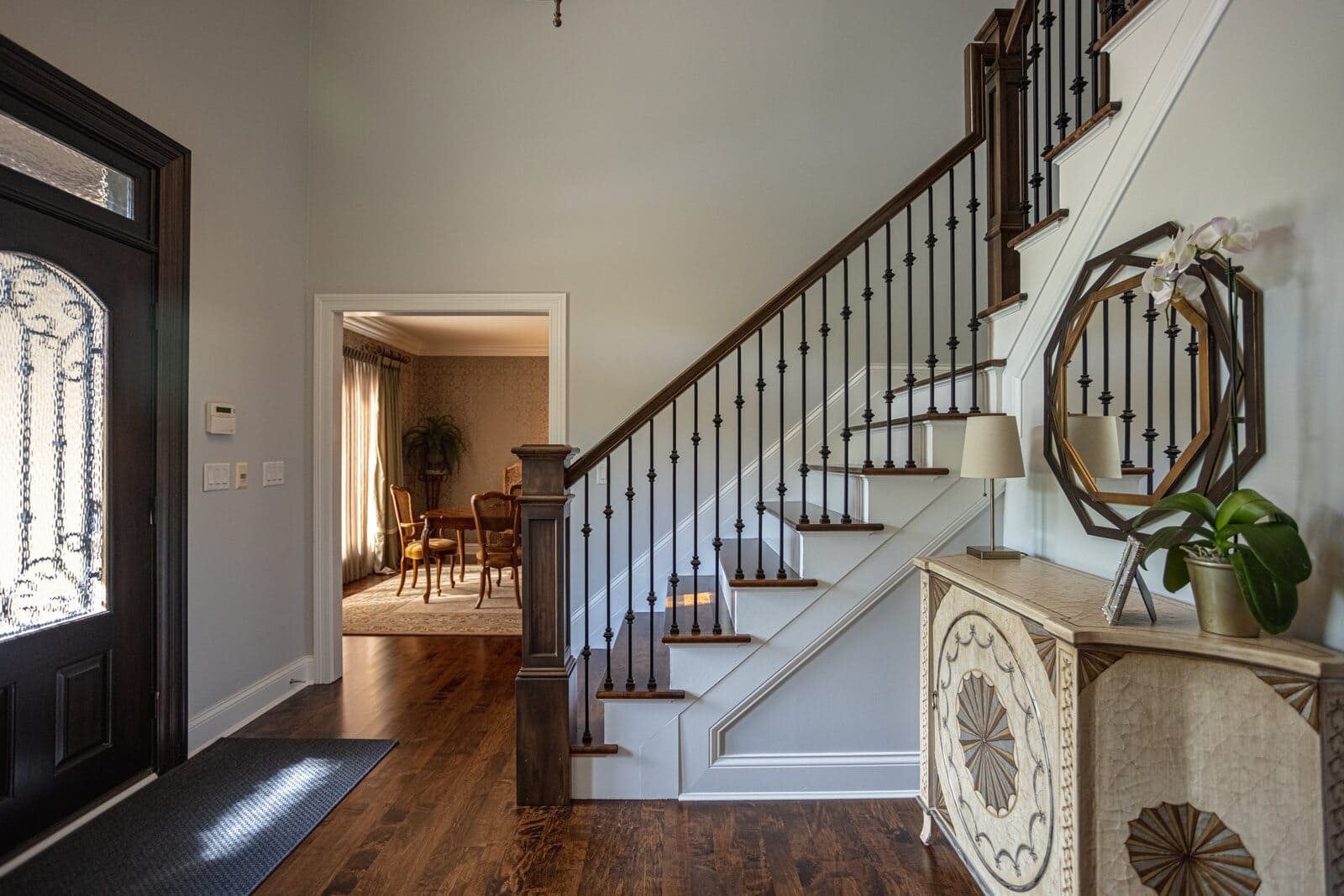 Foyer remodel with staircase and entryway console