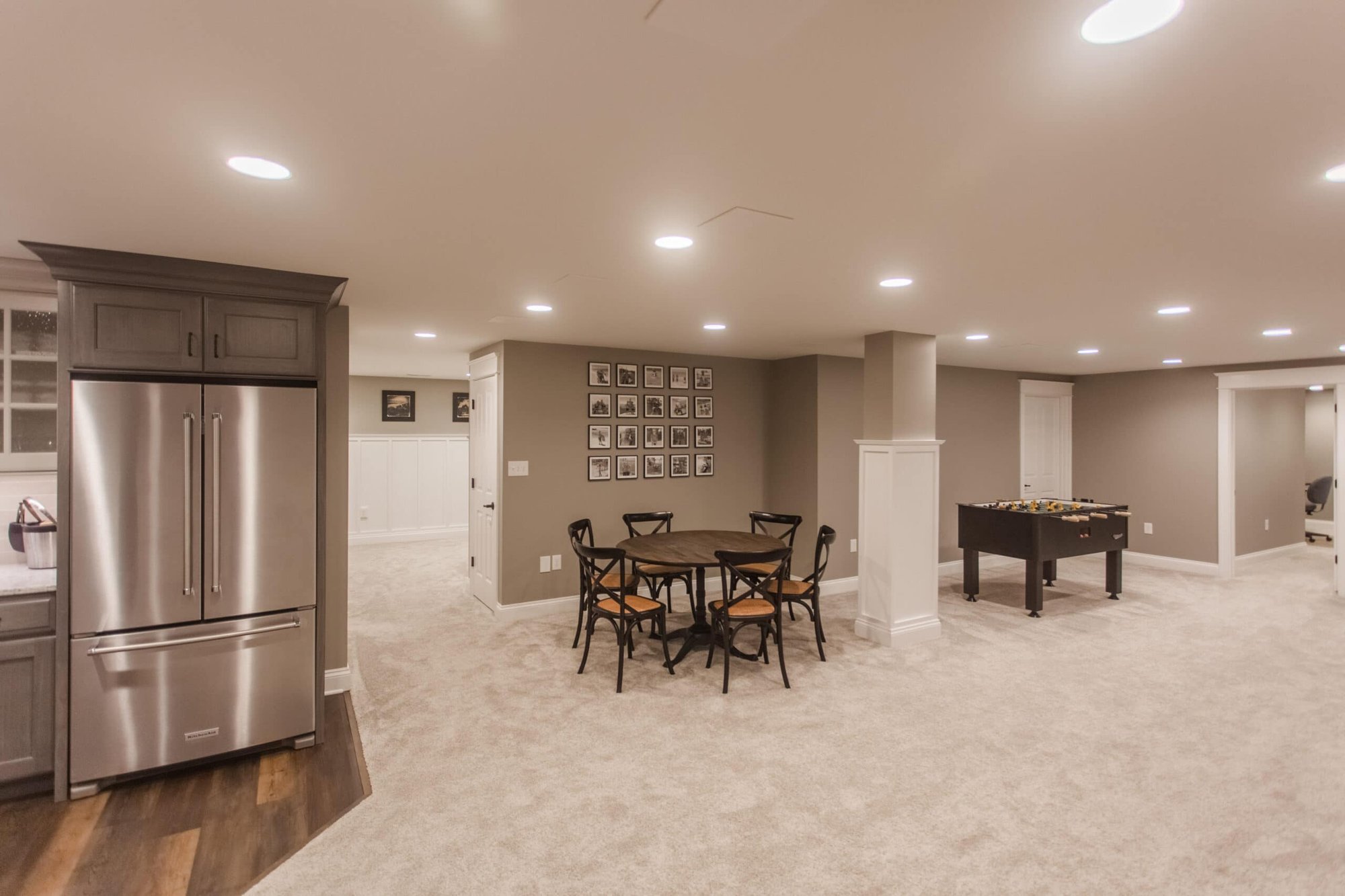 Amberly Village, OH basement rec room with wet bar, dining nook, game table, and open carpeted space