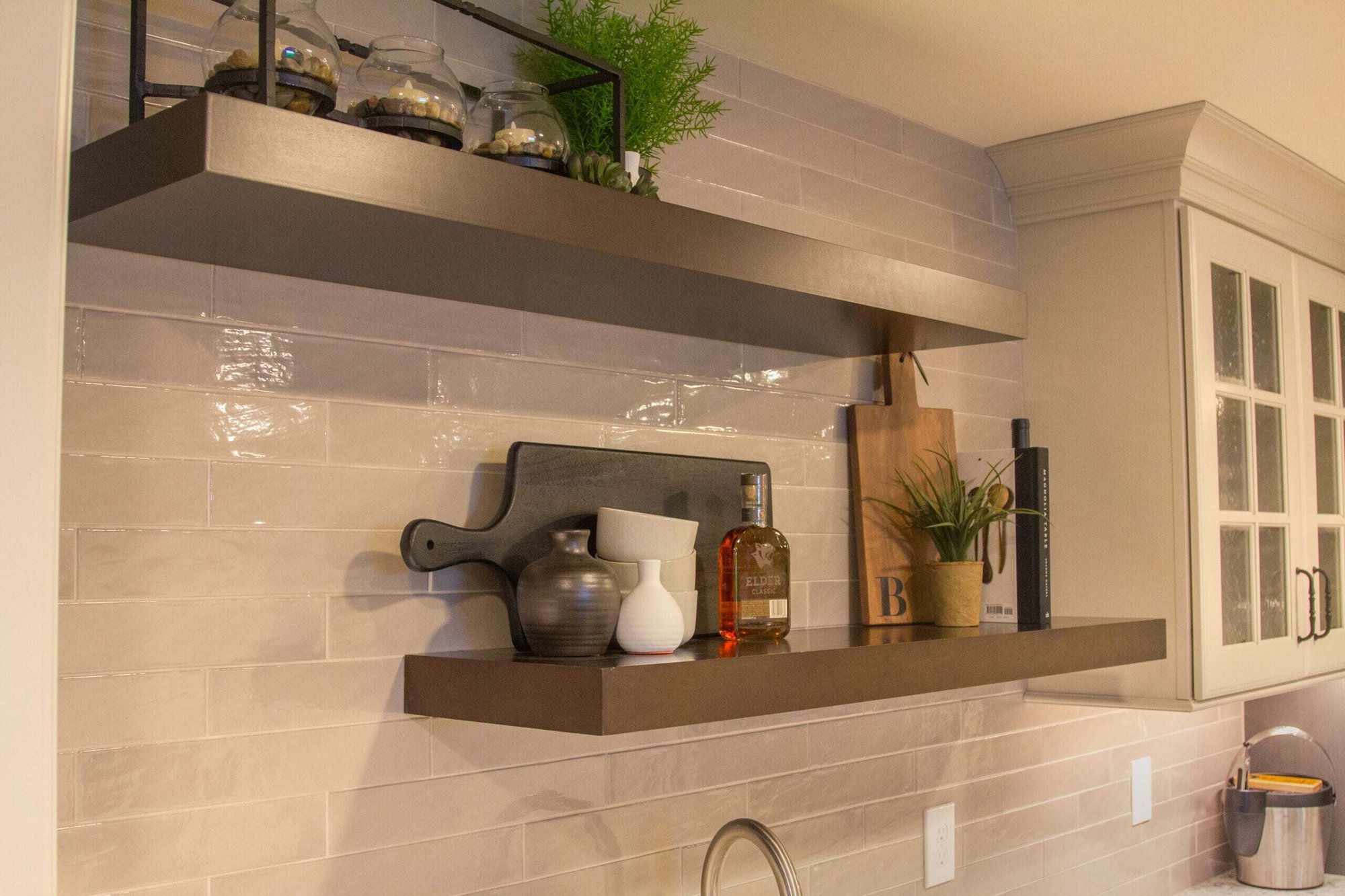 Amberly Village, OH wet bar shelves with glossy tile backsplash and decor