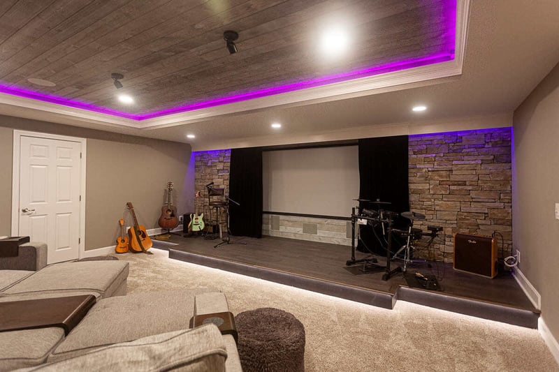 Basement theater stage with custom lighting in Cincinnati, OH basement remodel by Legacy Builders