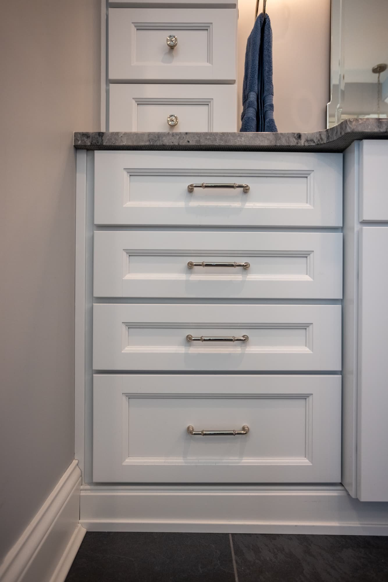 Bathroom vanity drawers with brushed metal hardware and marble top by Legacy Builders Group in Greater Cincinnati