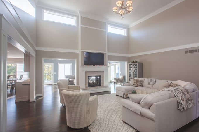 Family Great Rooms with high ceiling and pendant lighting fireplace tv above