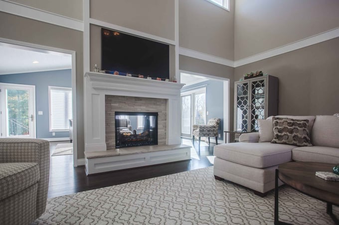 Home addition interior on first floor of Cincinnati, OH home with fireplace and TV above