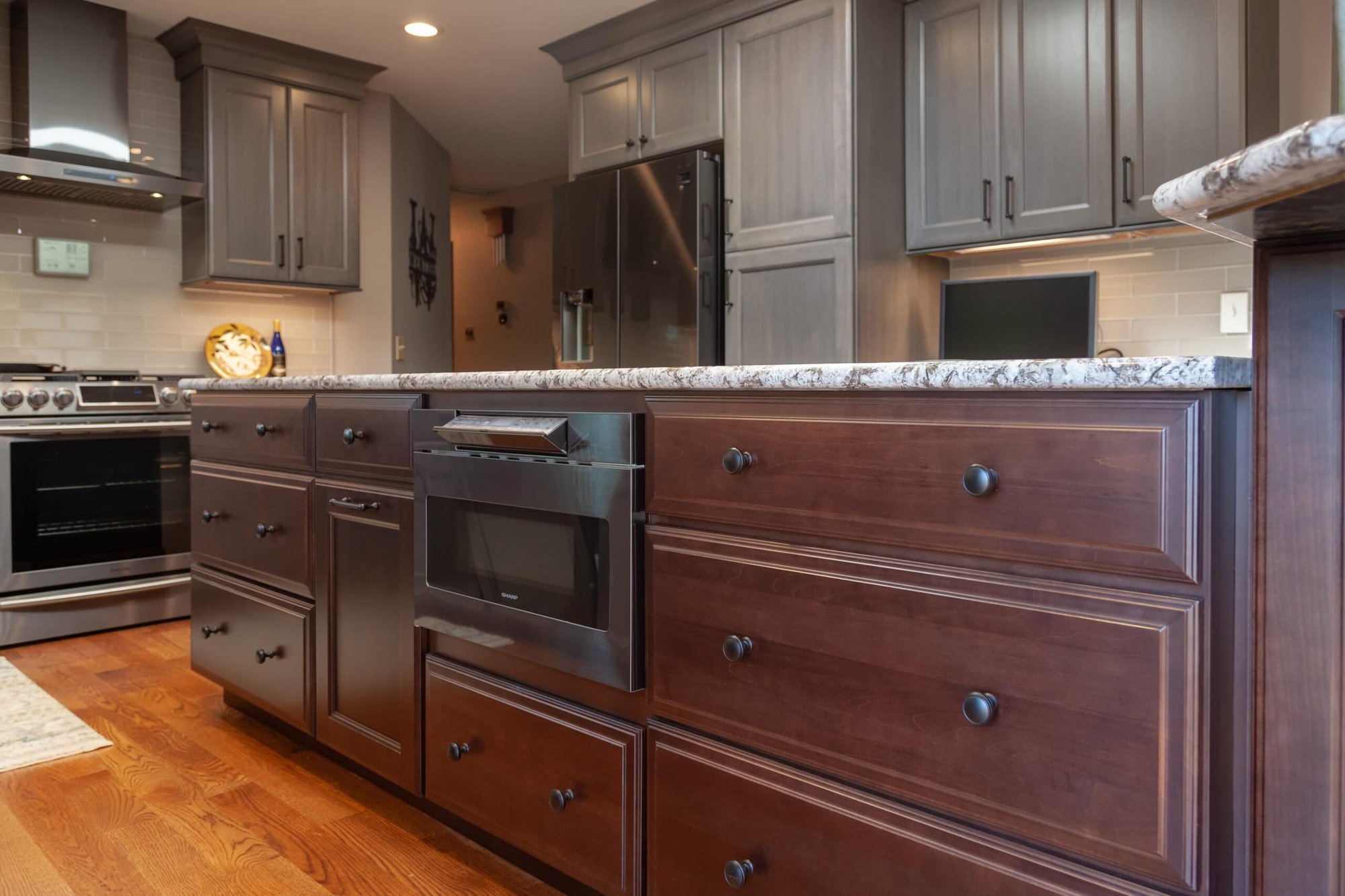 Kitchen remodel by Legacy Builders Group with a walnut island, gray cabinetry, and quartz countertops in Cincinnati, OH