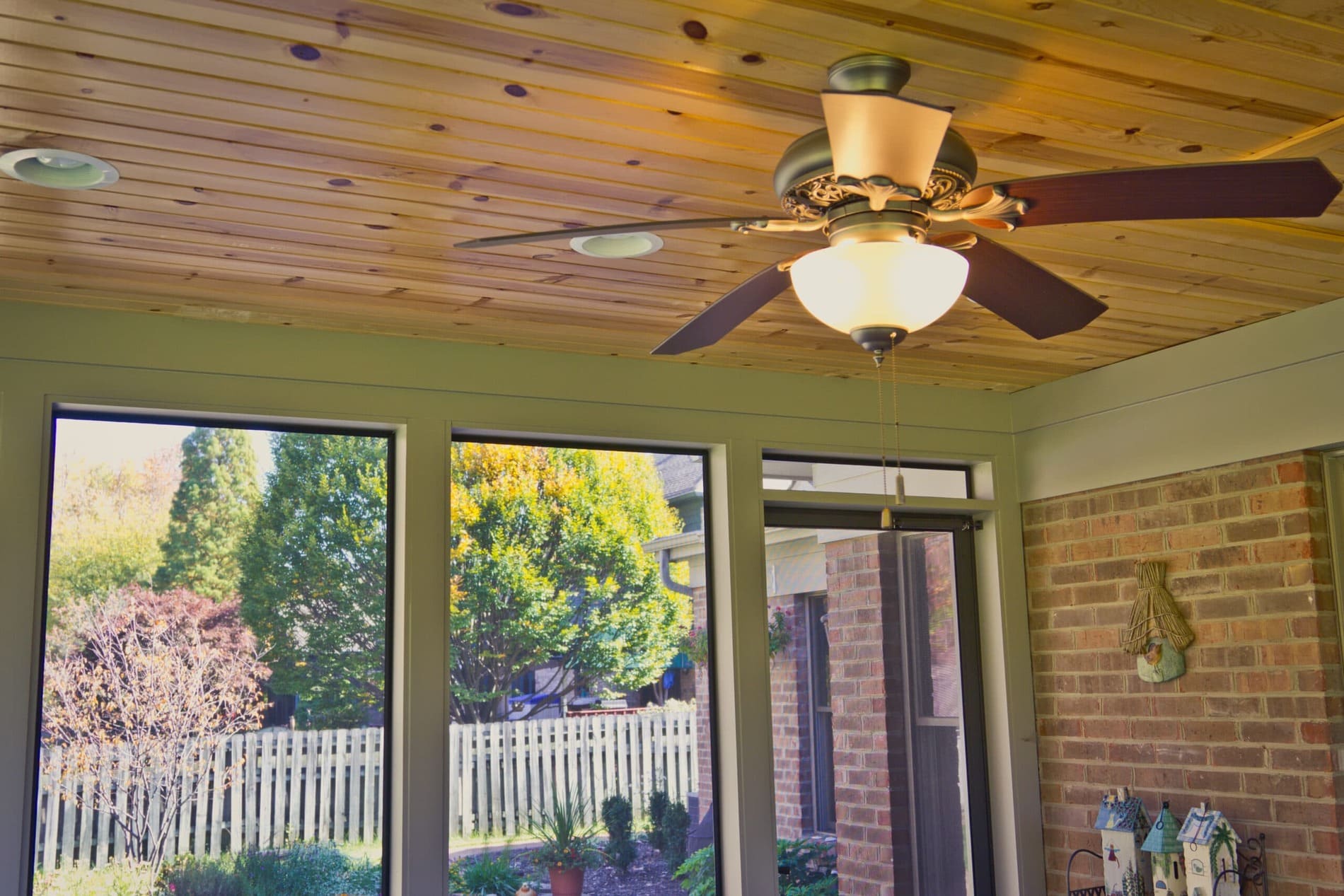 Screened porch ceiling with wood planks and ceiling fan by Legacy Builders Group in Greater Cincinnati