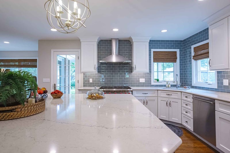 Stone kitchen countertop on kitchen island beneath pendant light in Cincinnati home remodel