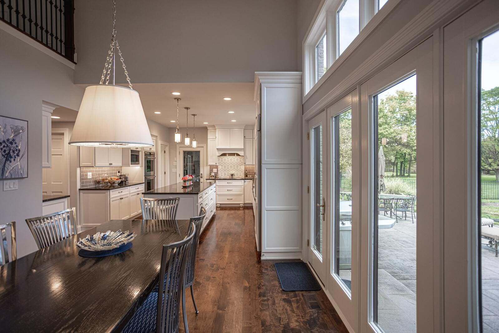 Open concept kitchen design with doors to back patio
