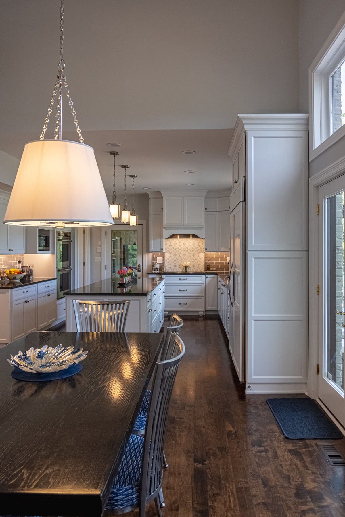 View of dining room table and kitchen in main floor remodel