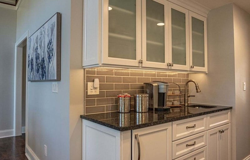 custom-beverage-station-and-coffee-bar-with-frosted-window-cabinets-above