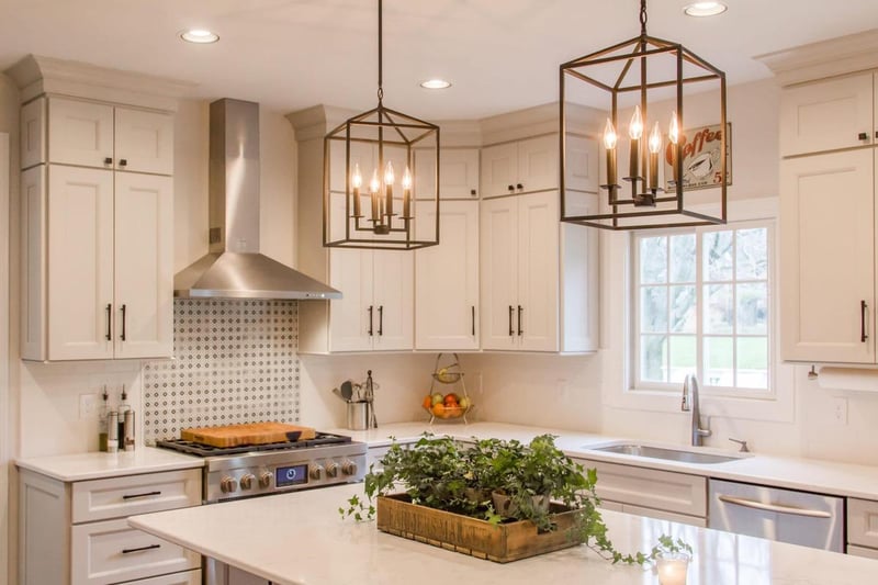 Kitchen remodel with island and hanging light fixtures above