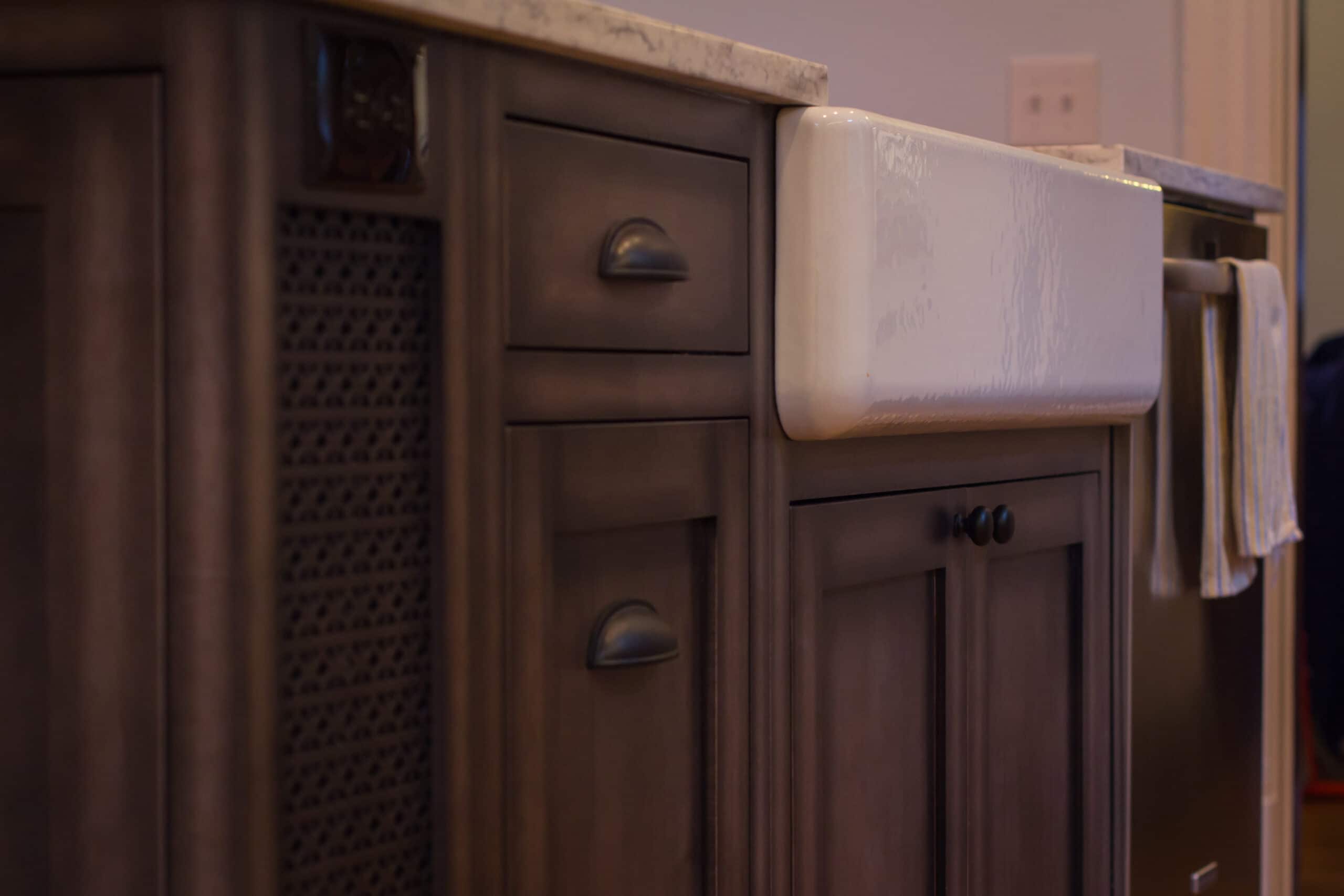 Up-close view of kitchen sink cabinetry
