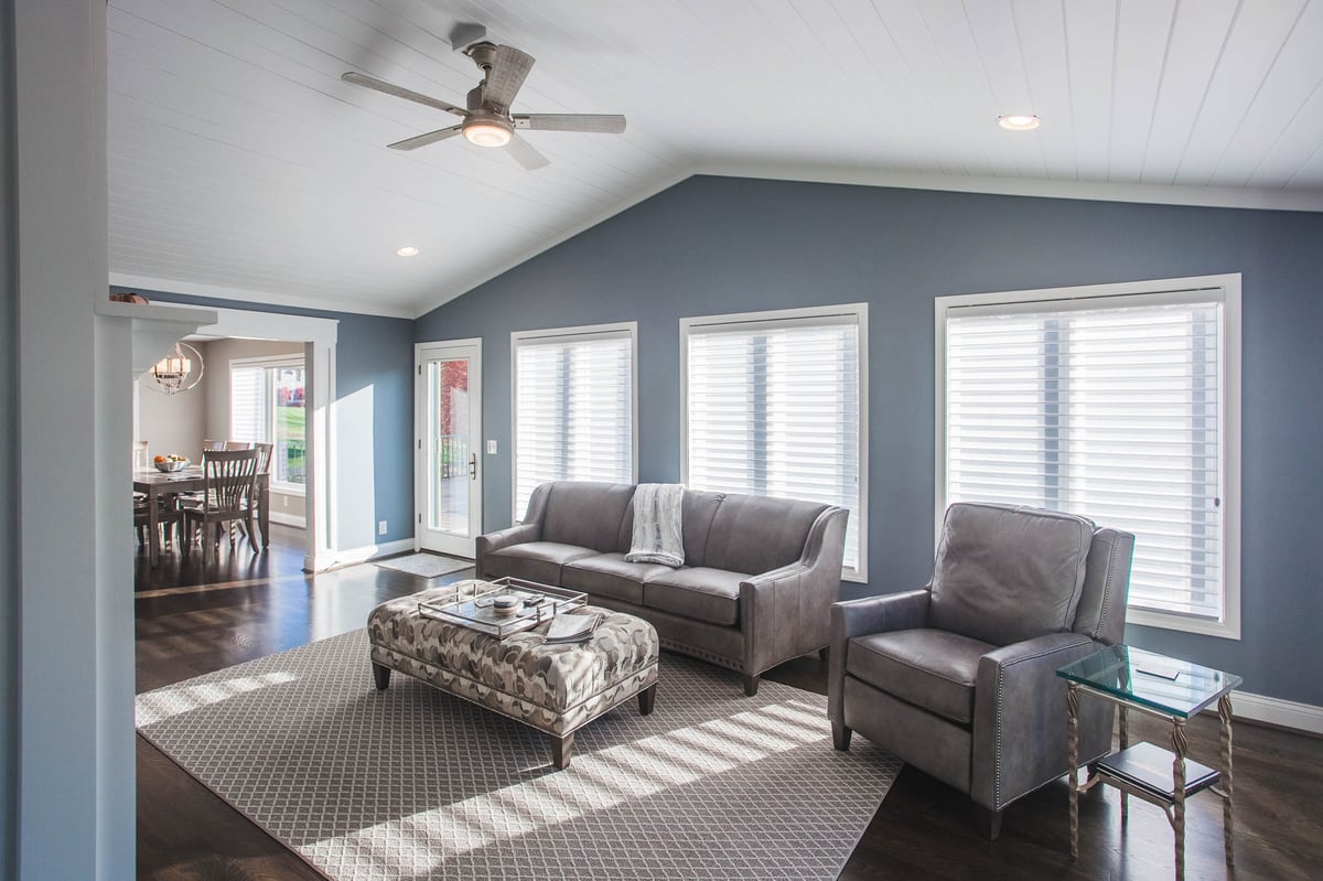 Cincinnati home addition with three windows behind furniture by Legacy Builders