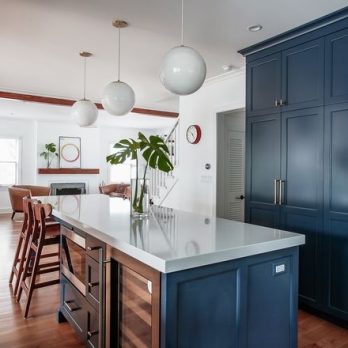 Kitchen with island and dark blue cabinets
