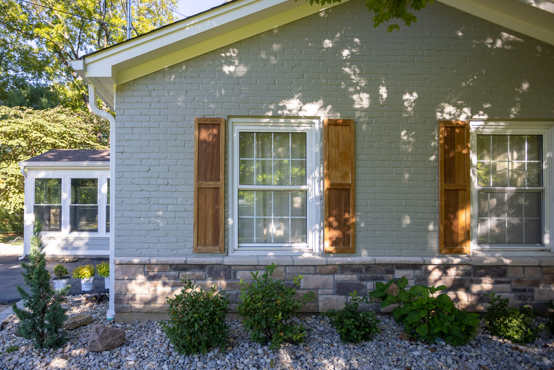 Light gray painted brick siding on Montgomery, Ohio home exterior remodel