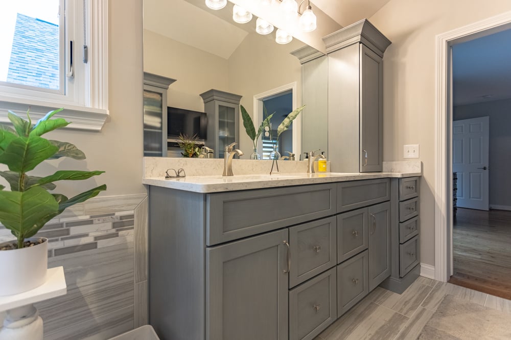 Cincinnati bathroom remodel featuring double vanity with ample storage and large well-lit mirror