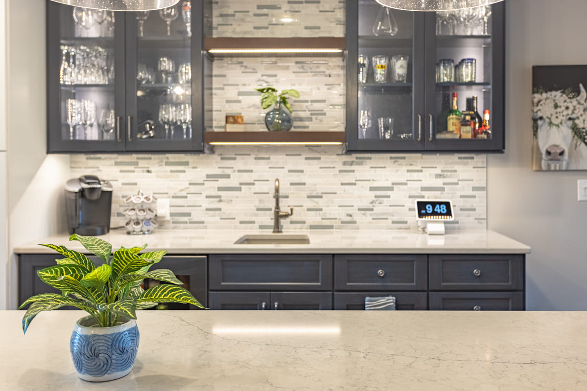Legacy Builders' kitchen renovation featuring a large island and task lights in beverage station