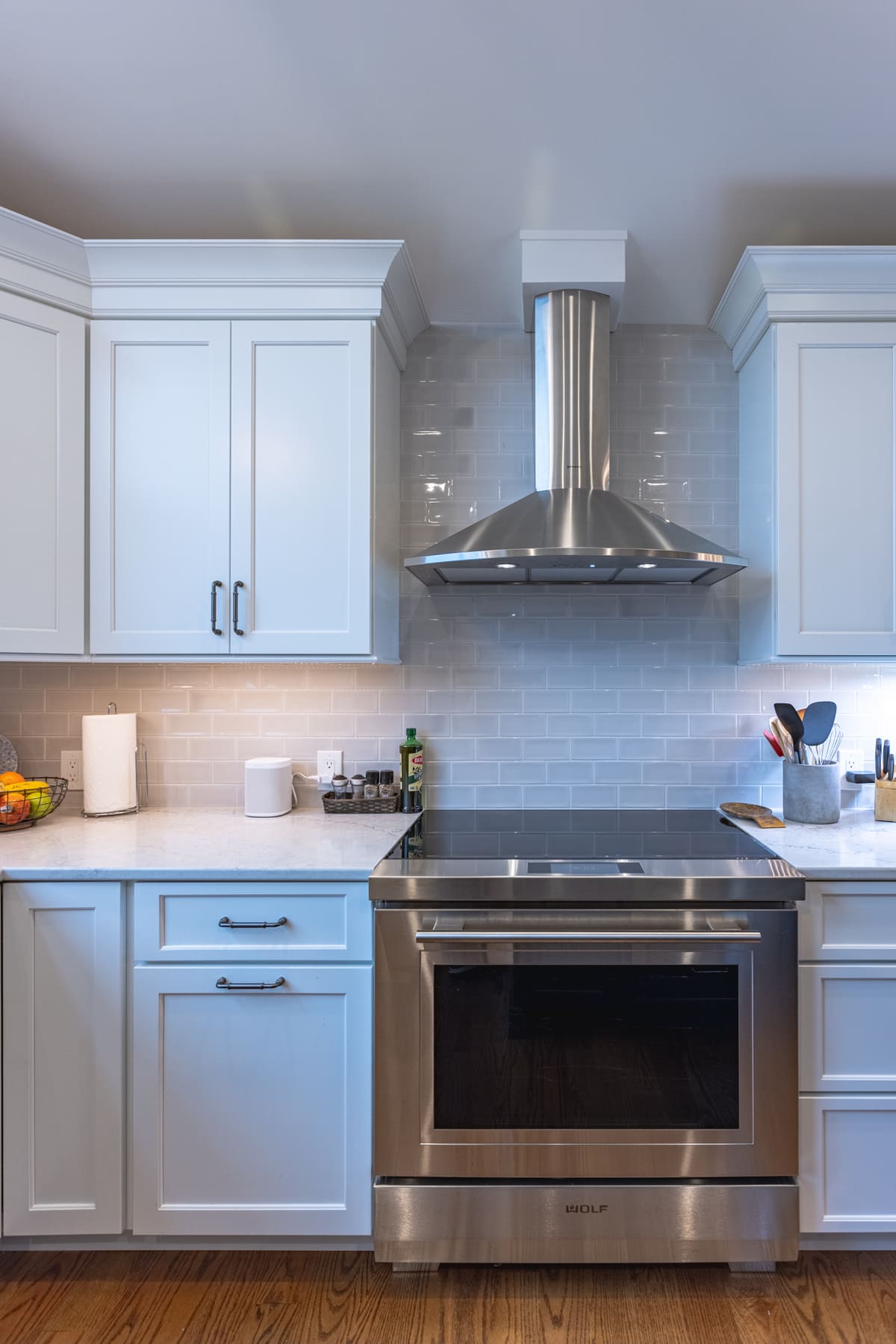 Task lighting beneath white shaker cabinets in kitchen remodel by Legacy Builders in Cincinnati