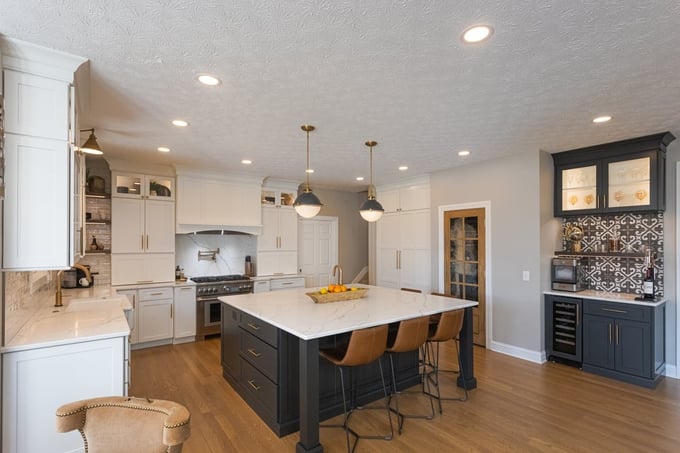 Cincinnati L shaped kitchen by Legacy Builders Group with central island with seating and sink and coffee bar