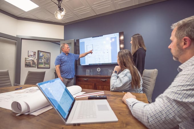 Legacy Builders team working in office