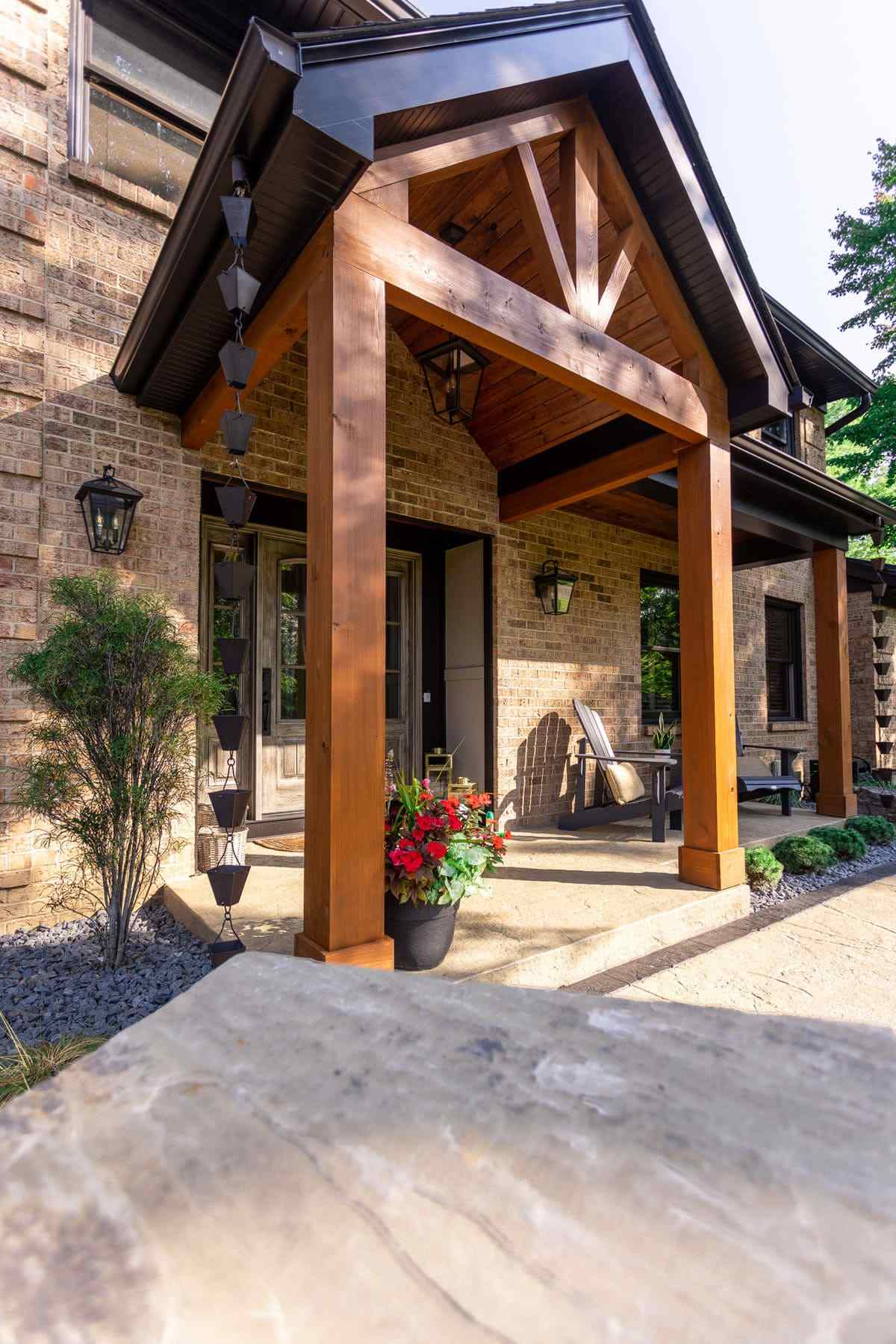 View of front entrance with cedar posts on attached porch
