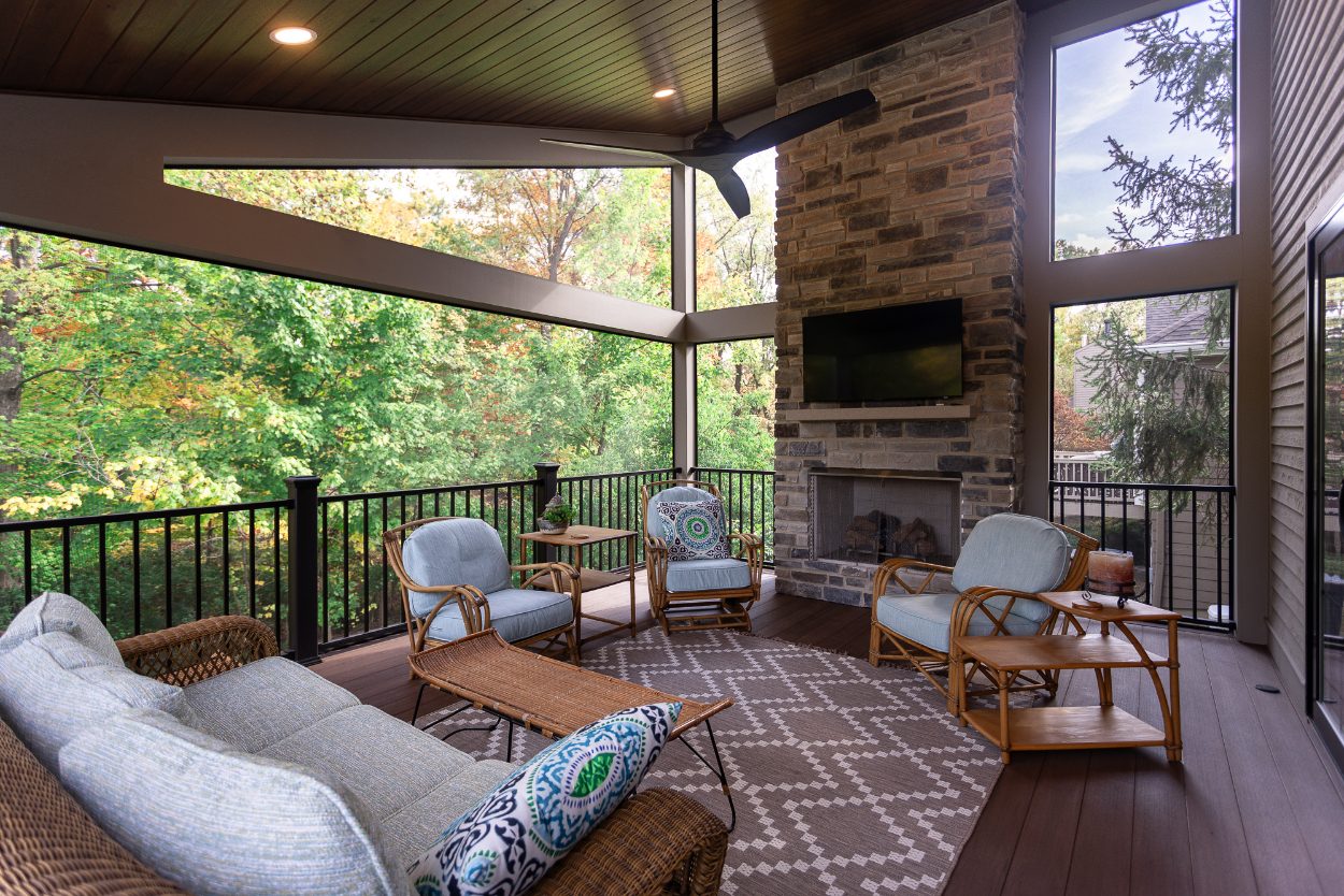 Screened-in porch addition in Evendale, Ohio with sloped roof and fireplace