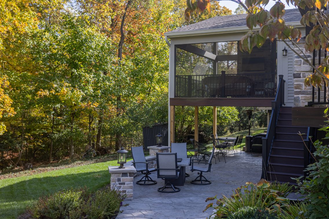 Screened-in porch addition in Evendale, Ohio with steps to patio beneath by Legacy Builders